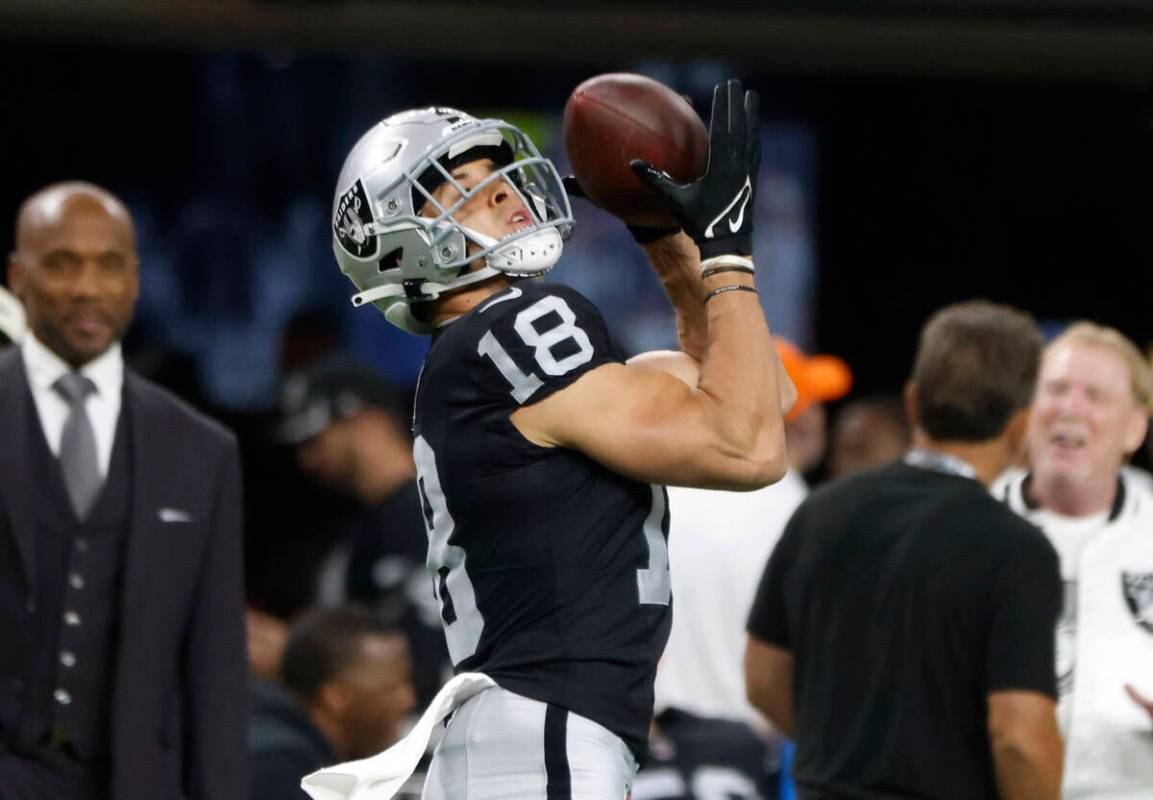 Raiders wide receiver Jack Bech (18) catches a pass during a warm up prior to an NFL football g ...