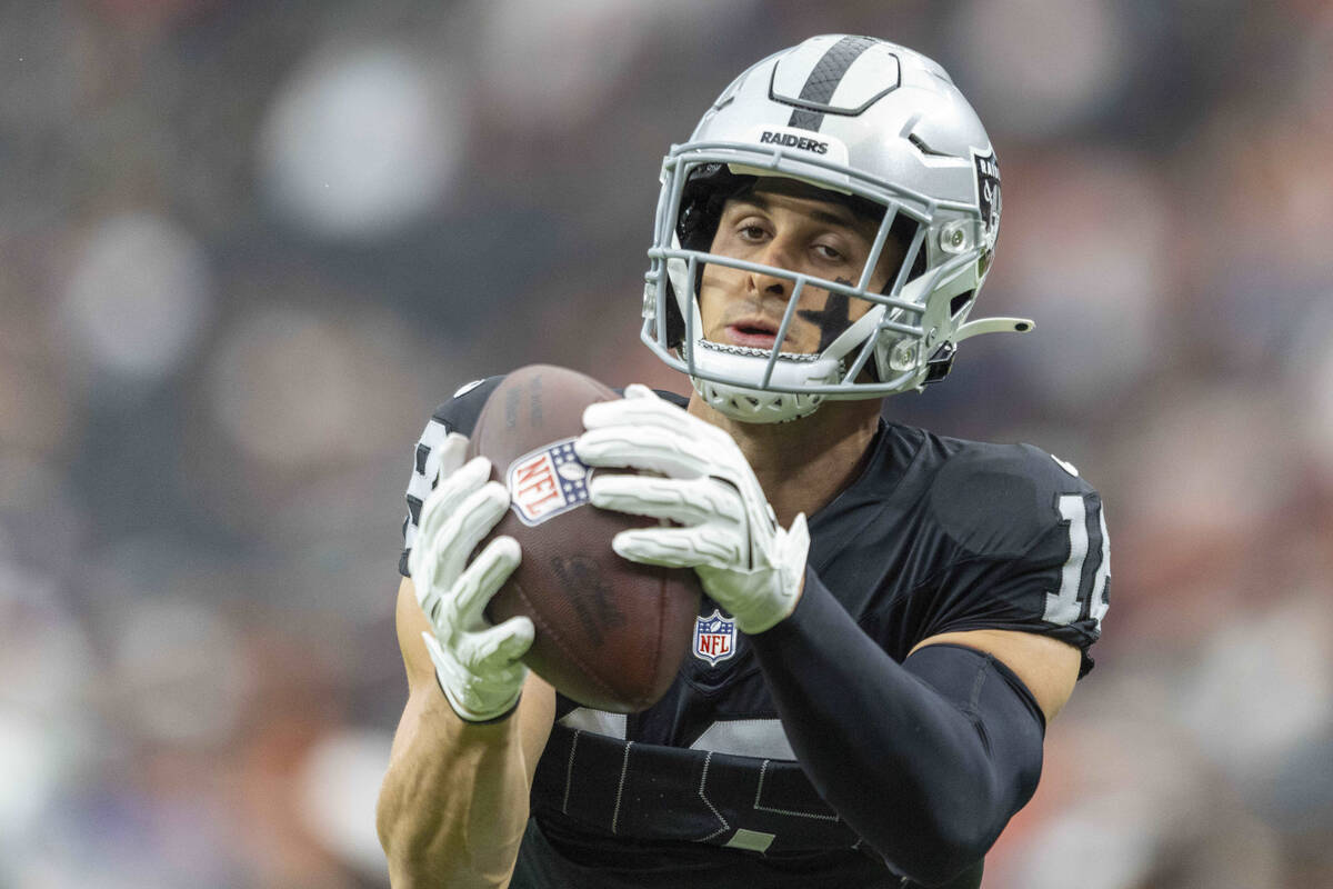 Raiders wide receiver Jack Bech (18) makes a catch before an NFL game against the Chicago Bears ...