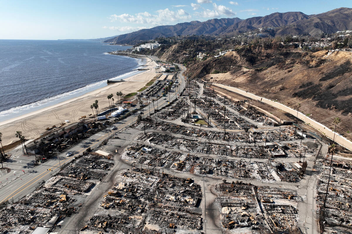FILE - An aerial view shows the devastation left by the Palisades Fire in the Pacific Palisades ...