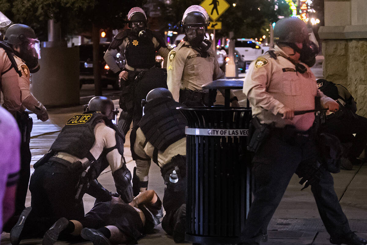Las Vegas police arrest a protester on Wednesday, June 11, 2025, in downtown Las Vegas. (Chase ...