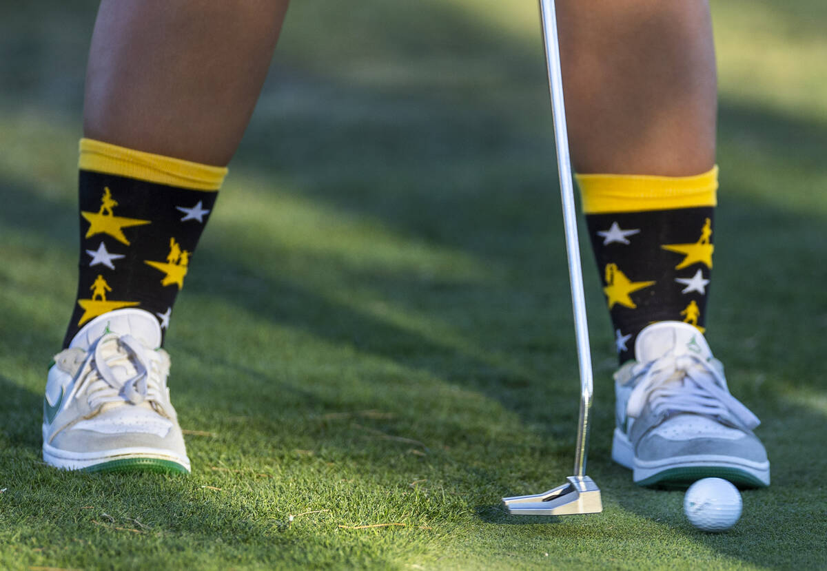 Palo Verde's Rivers Common sports some cool socks as she putts the ball during the final r ...