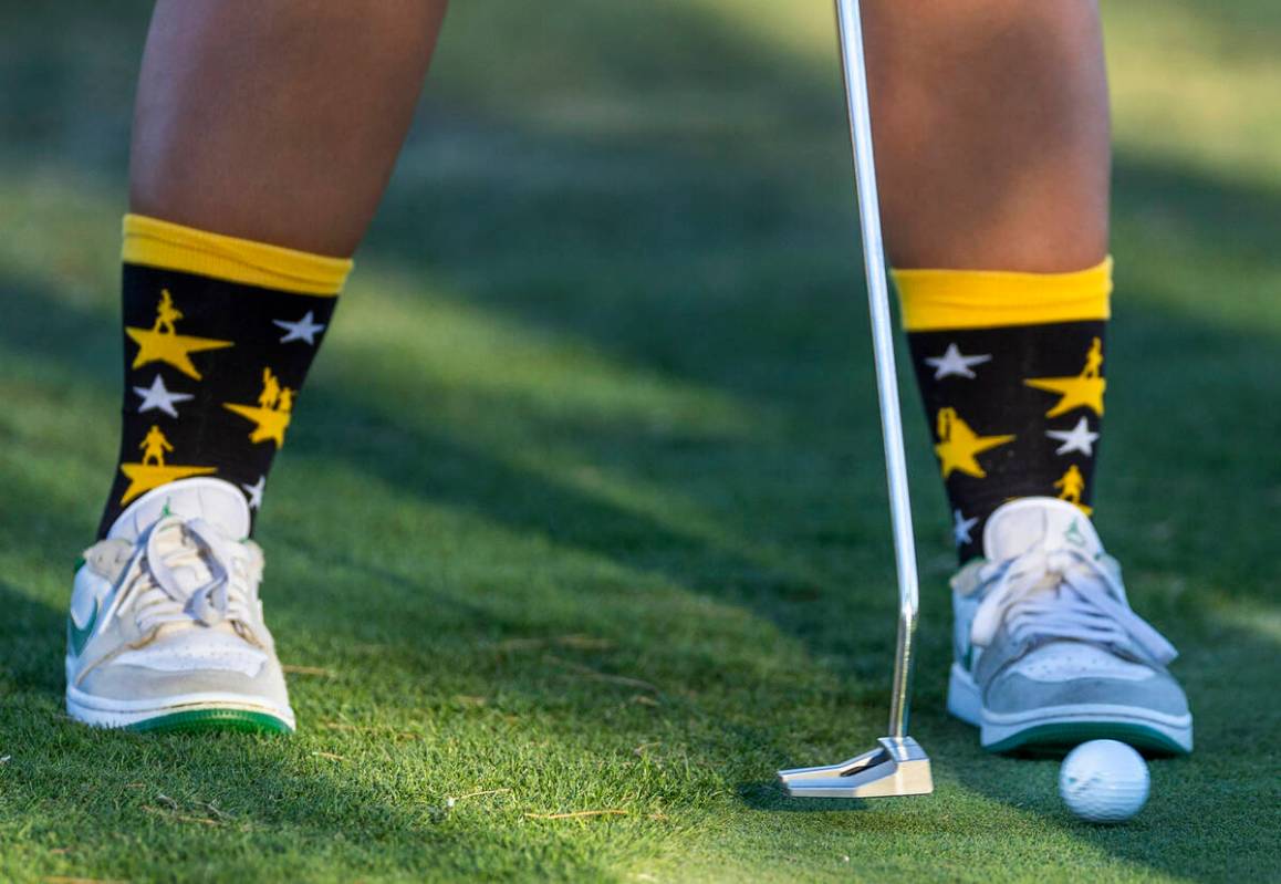Palo Verde's Rivers Common sports some cool socks as she putts the ball during the final r ...