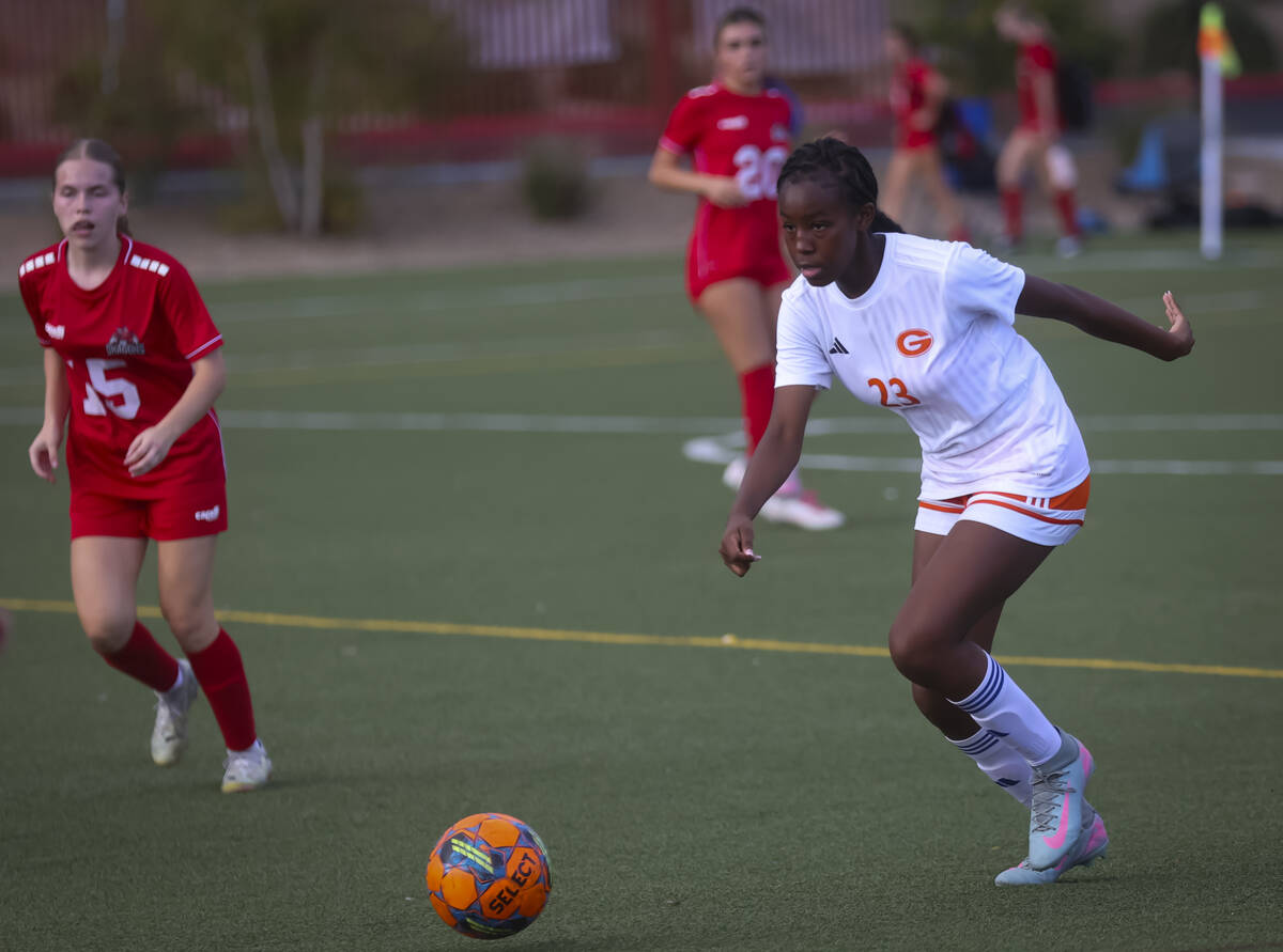 Bishop Gorman's Aleah Warner (23) runs with the ball during a soccer game at Doral Academy ...