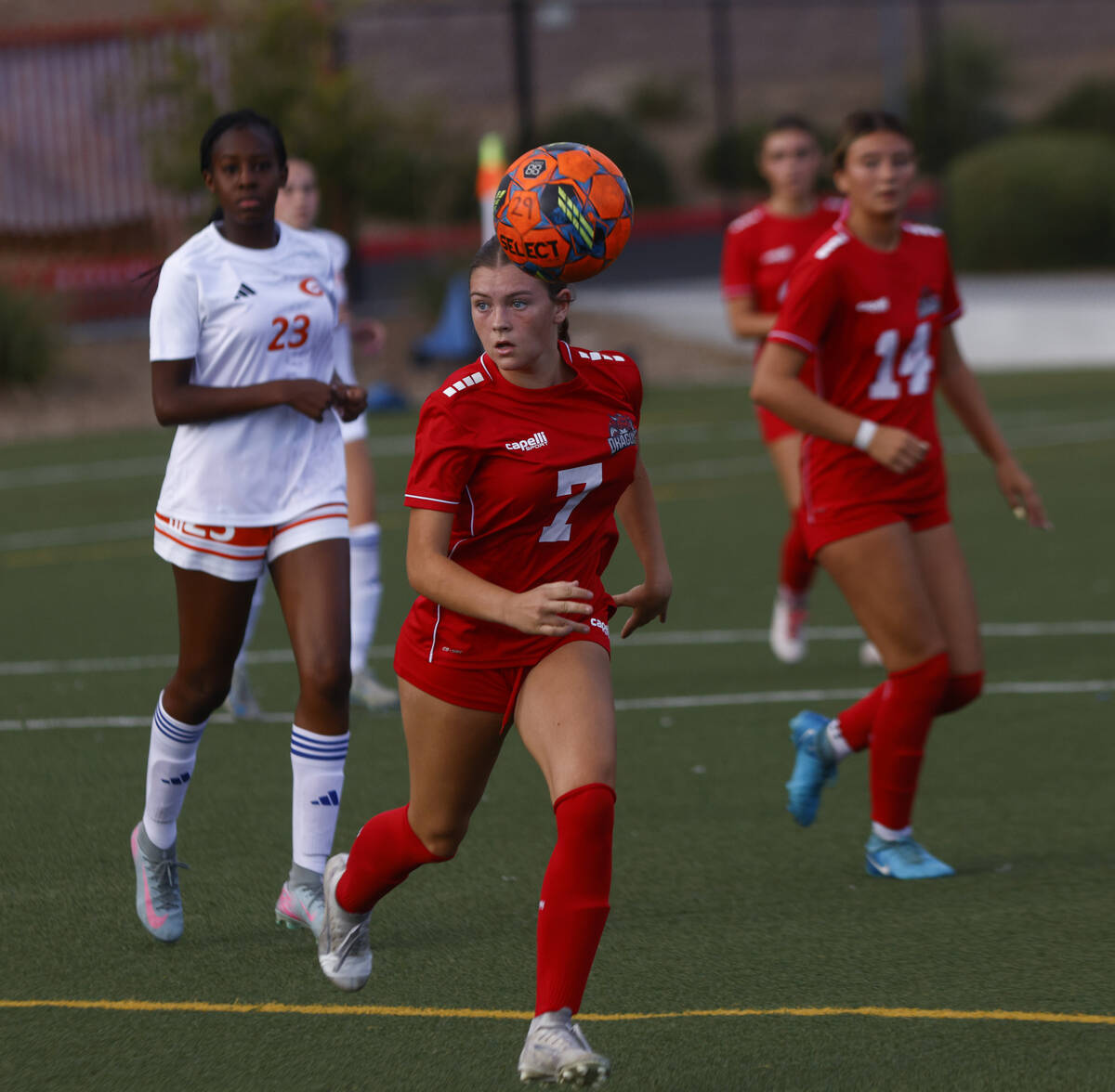 Doral Academy's Marleigh King (7) looks up the field while running with the ball during a ...