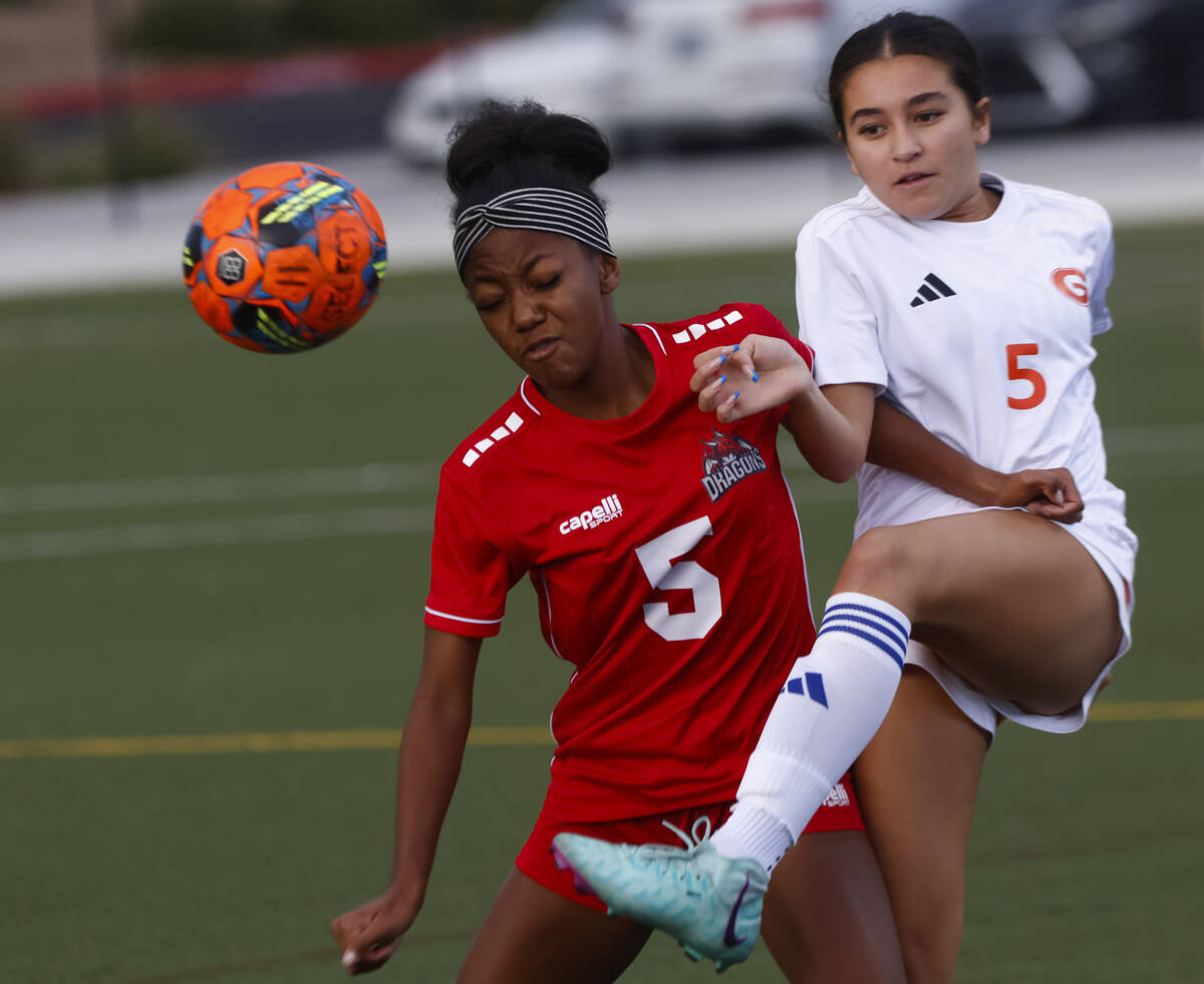 Bishop Gorman's Iolana Reilly, right, kicks the ball against Doral Academy's Sanyi Th ...