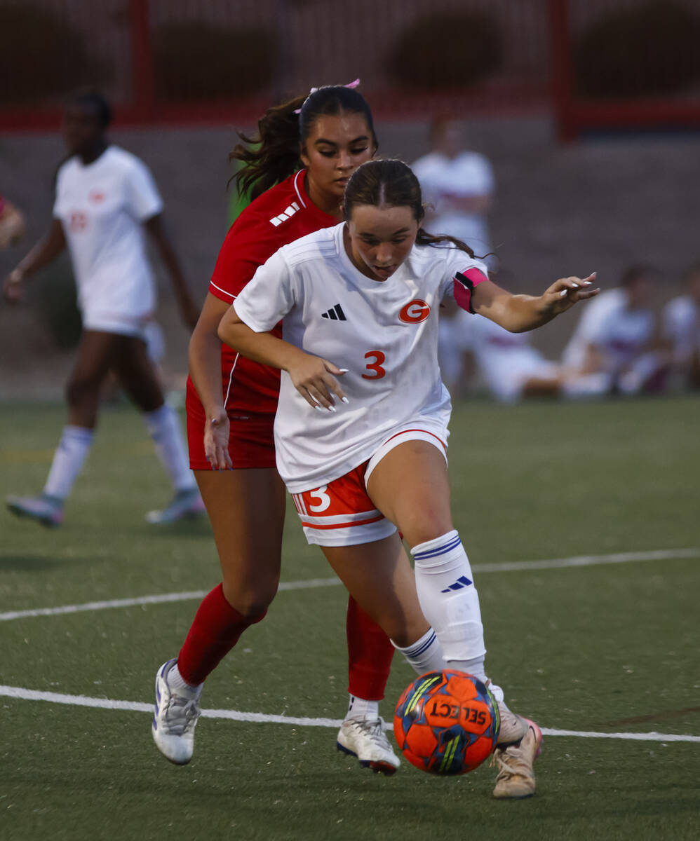 Bishop Gorman's Emma Flannery (3) moves the ball under pressure from Doral Academy's ...