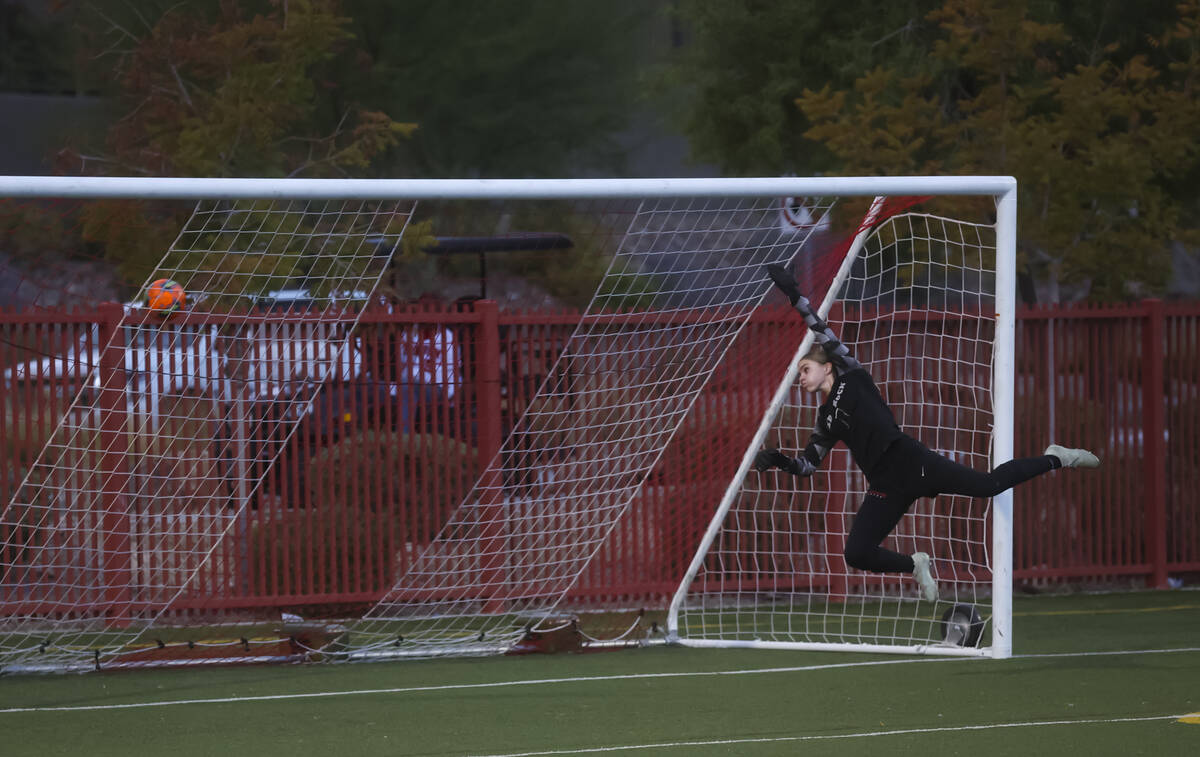 Doral Academy goalkeeper Kenadie Mashore jumps to block a shot from Bishop Gorman then went ove ...