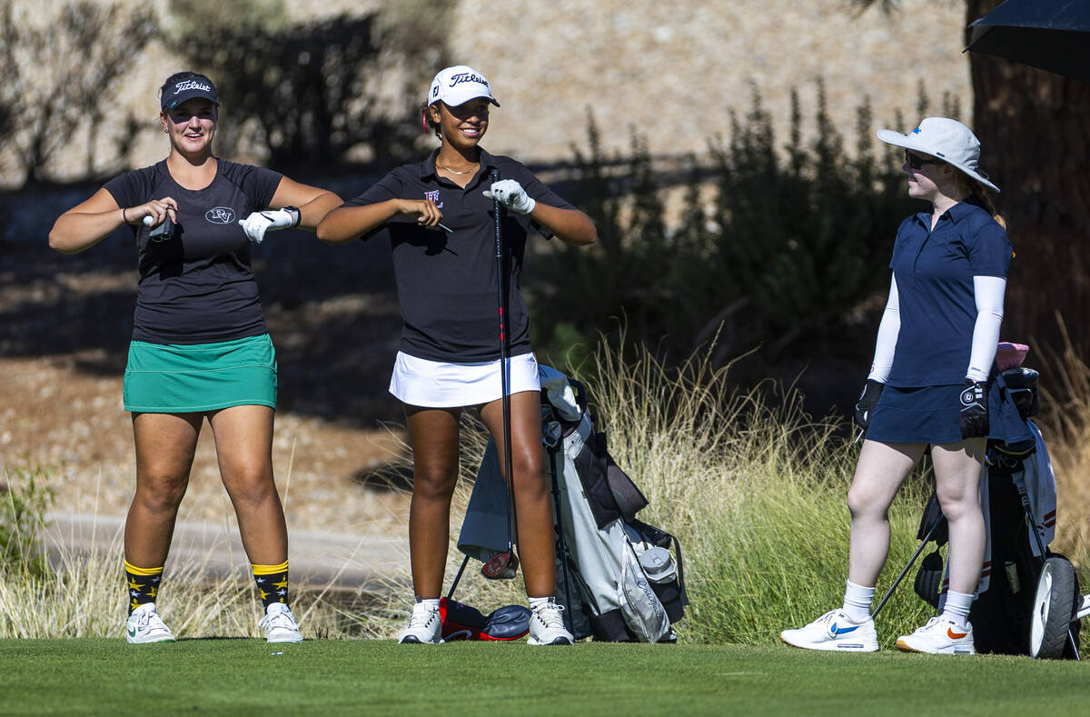 Palo Verde's Sage Perry and Faith Lutheran's Macy Garth flap their arms like birds as ...