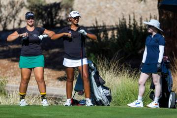 Palo Verde's Sage Perry and Faith Lutheran's Macy Garth flap their arms like birds as ...