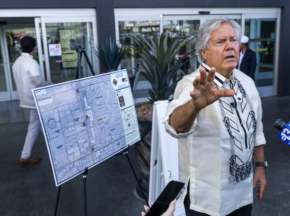 Clark County Commissioner Tick Segerblom celebrates the sign unveiling for the Filipino Town cu ...