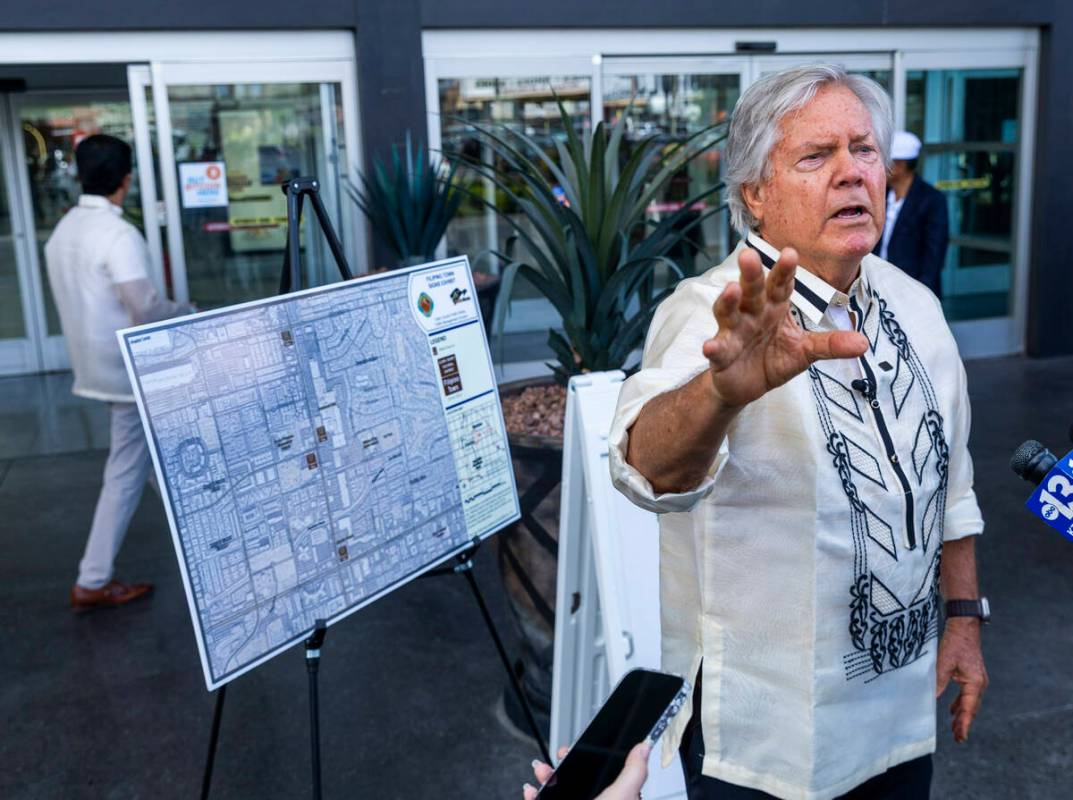 Clark County Commissioner Tick Segerblom celebrates the sign unveiling for the Filipino Town cu ...