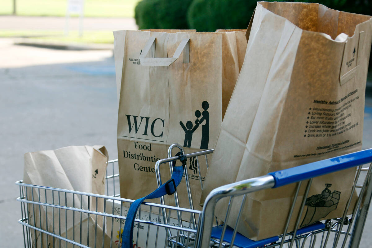 Grocery bags with food from the Special Supplemental Nutrition Program for Women, Infants and C ...