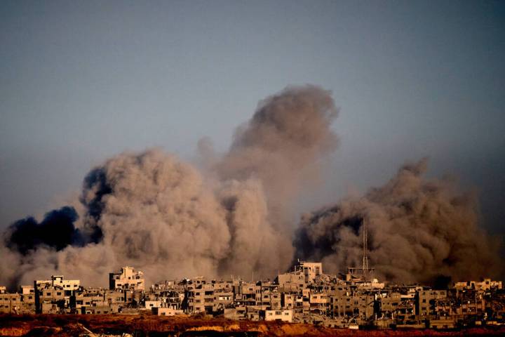 Smoke rises following an Israeli military strike in the northern Gaza Strip, seen from southern ...