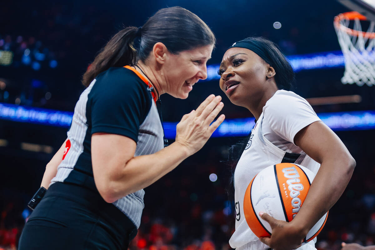 Aces guard Dana Evans (11) reacts to a referee’s reasoning for a foul during game three ...