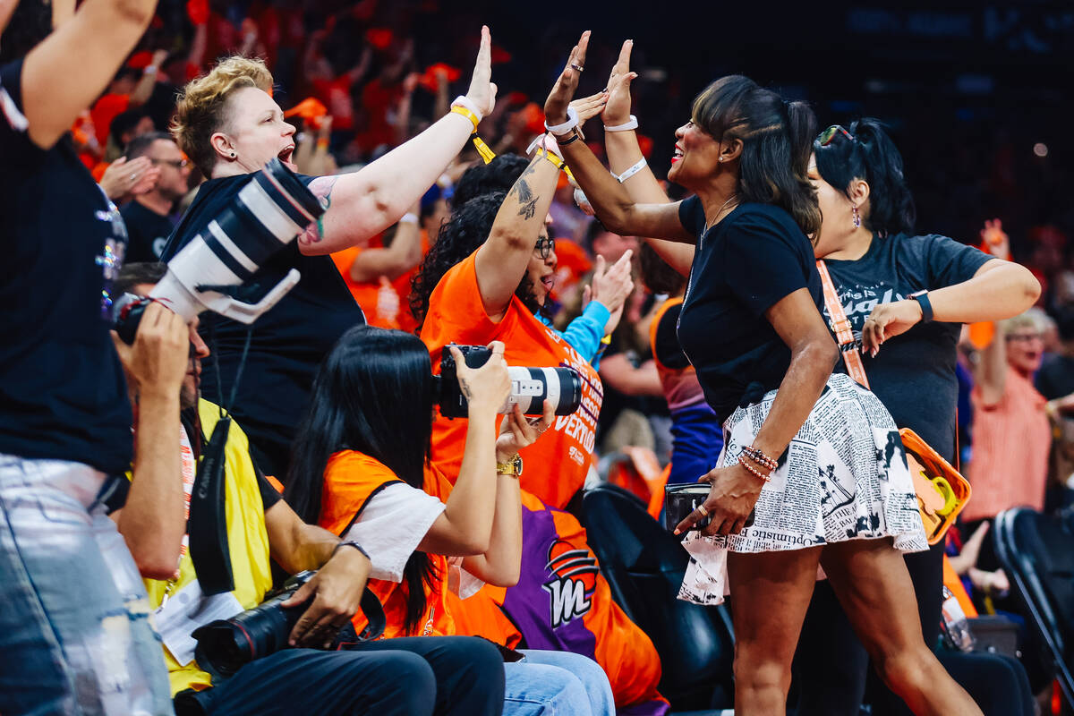 Phoenix Mercury fans react to game play during game three of a WNBA finals match up between the ...