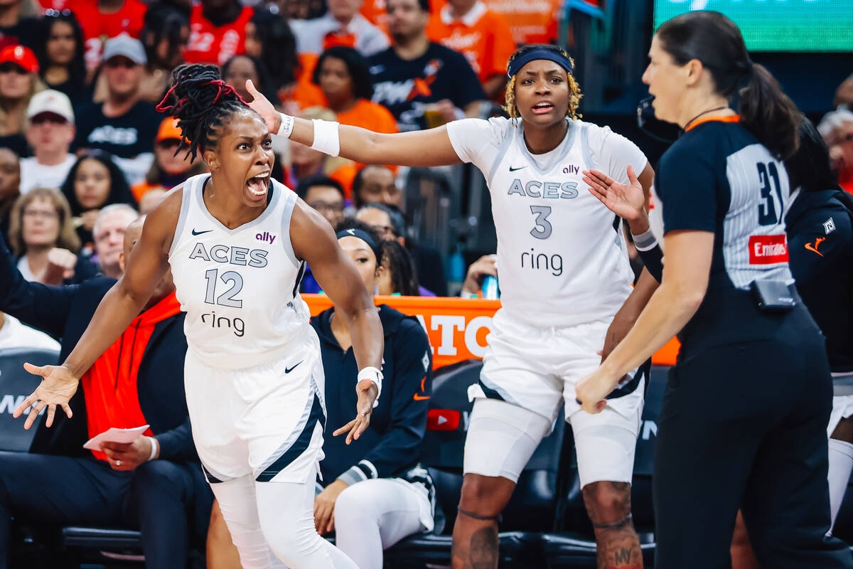 Aces guard Chelsea Gray (12) reacts to a referee not calling a foul during game three of a WNBA ...