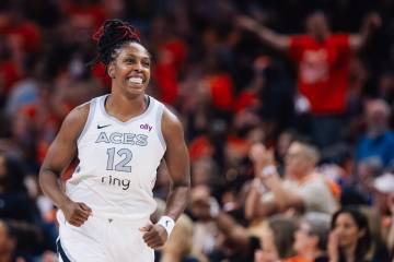 Aces guard Chelsea Gray (12) smiles during game three of a WNBA finals match up between the Ace ...
