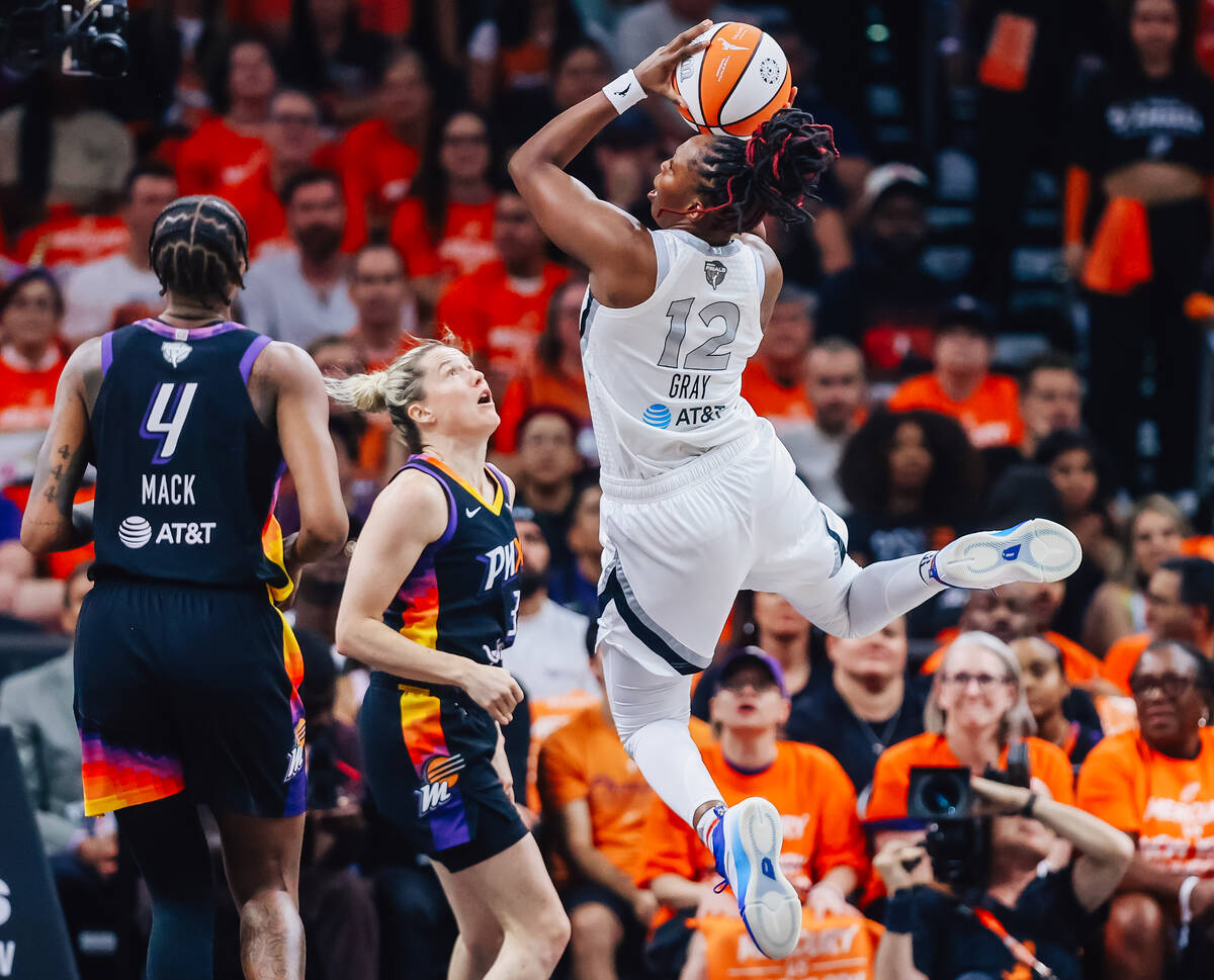 Aces guard Chelsea Gray (12) jumps for a shot during game three of a WNBA finals match up betwe ...