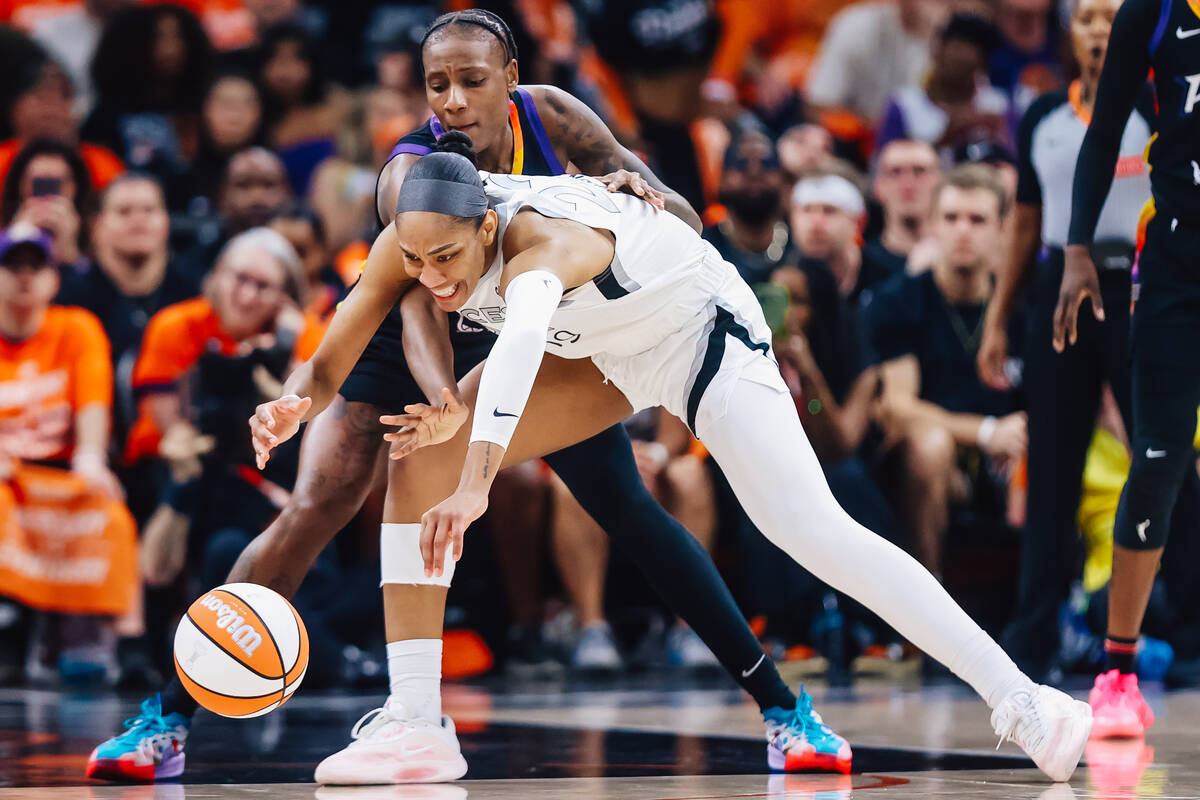 Aces center A'ja Wilson (22) loses the ball for a moment during game three of a WNBA final ...