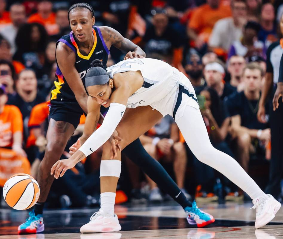 Aces center A'ja Wilson (22) loses the ball for a moment during game three of a WNBA final ...