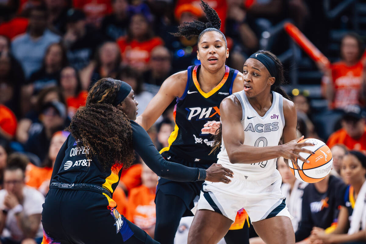 Aces guard Jackie Young (0) looks for an open teammate during game three of a WNBA finals match ...