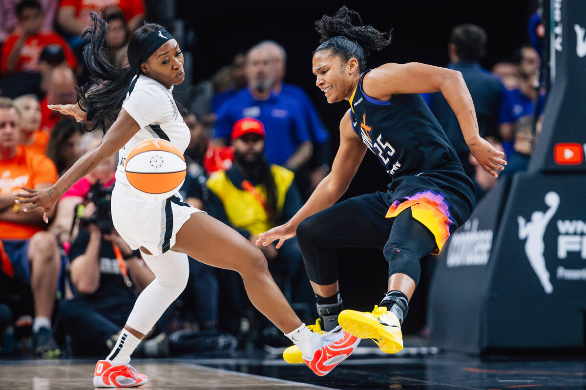 Phoenix Mercury forward Alyssa Thomas (25) loses the ball as Aces guard Dana Evans (11) defends ...