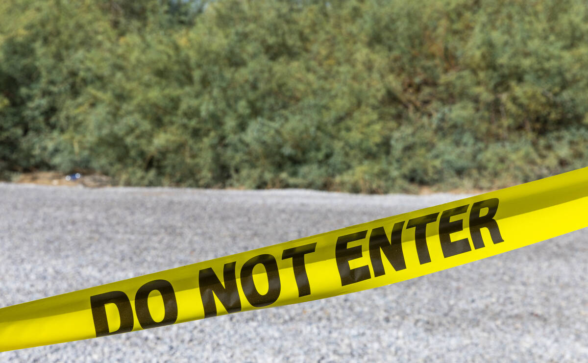 Caution tape closes off a parking lot at Sunset Park following a homicide early in the morning ...