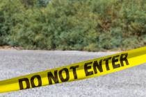 Caution tape closes off a parking lot at Sunset Park following a homicide early in the morning ...