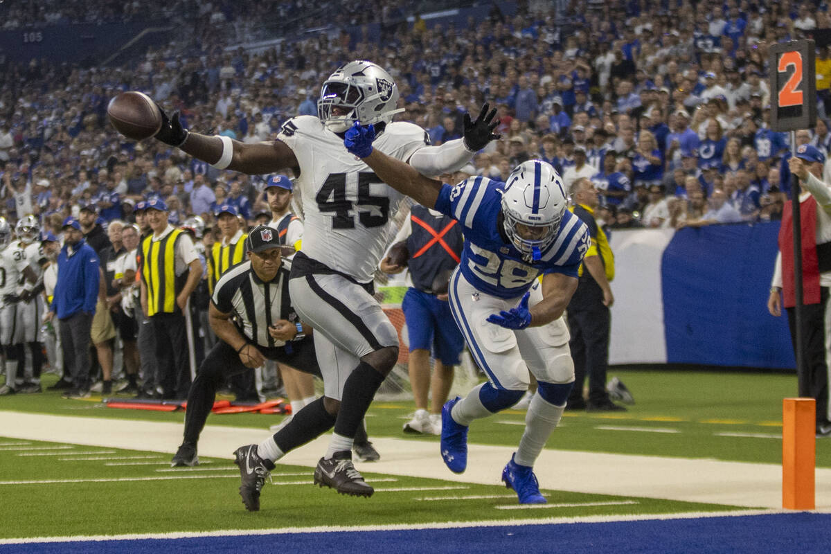 Raiders linebacker Devin White (45) is called for pass interference while defending against Ind ...