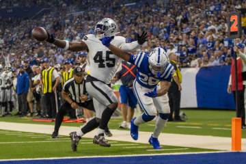 Raiders linebacker Devin White (45) is called for pass interference while defending against Ind ...