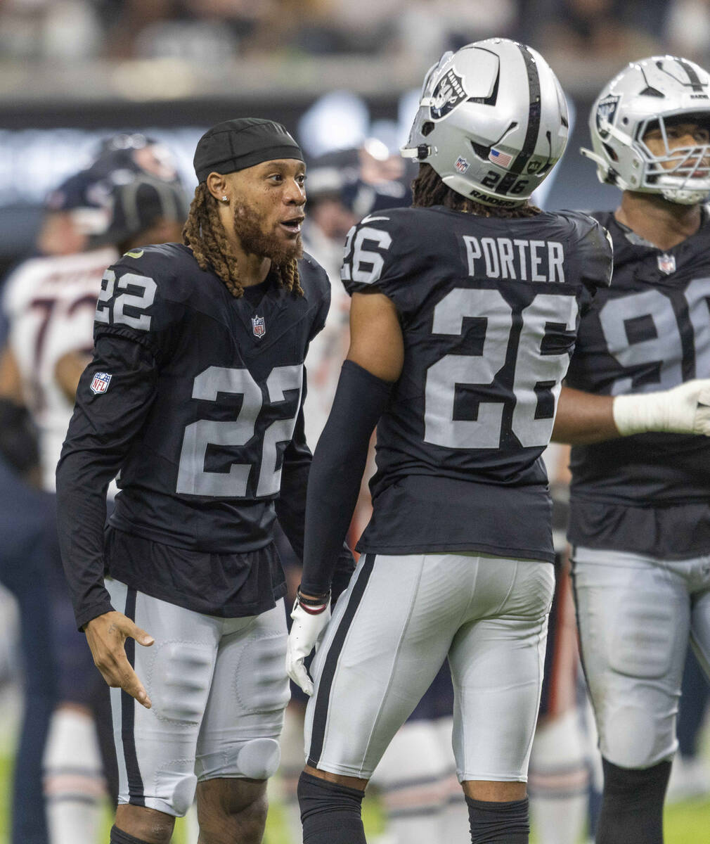 Raiders cornerback Eric Stokes (22) speaks to cornerback Darien Porter (26) during the second h ...