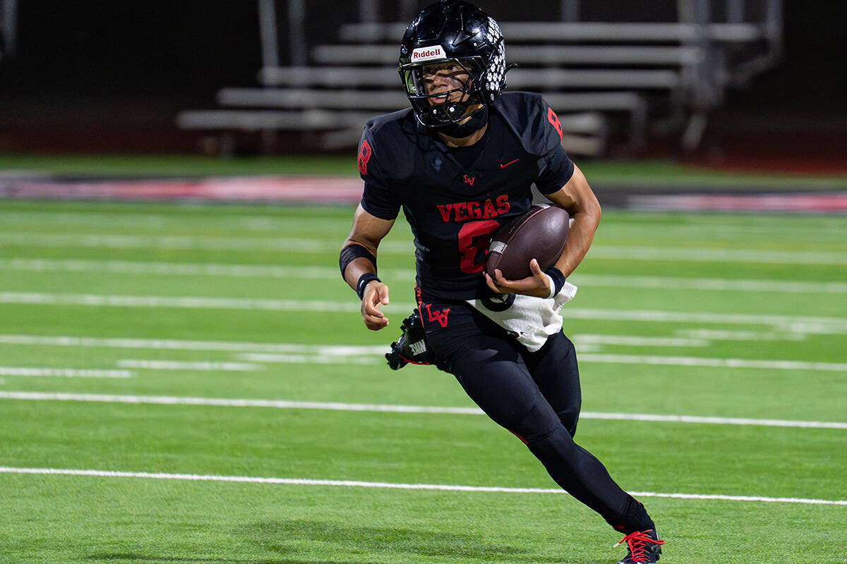 Las Vegas’s QB Tanner Vibabul (8) looks for an open pass during a football game against ...