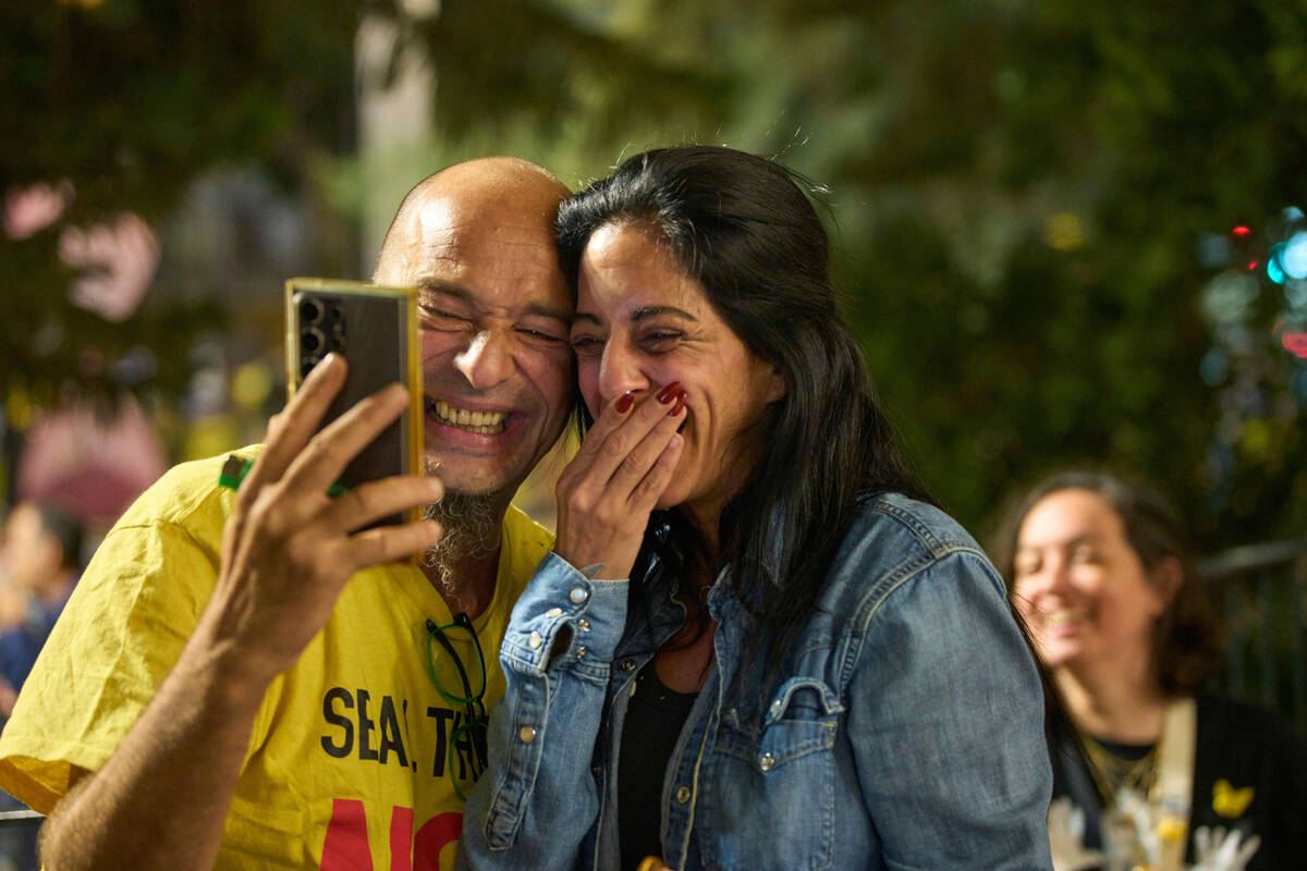 Einav Zangauker, center, mother of Matan Zangauker, who is being held hostage by Hamas, reacts ...