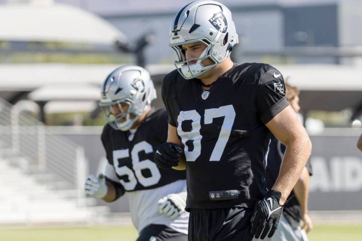 Raiders tight end Michael Mayer (87) runs through a drill with guard Atonio Mafi (56) during th ...