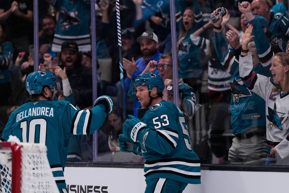 San Jose Sharks left wing Jeff Skinner (53) celebrates with center Ty Dellandrea (10) after sco ...