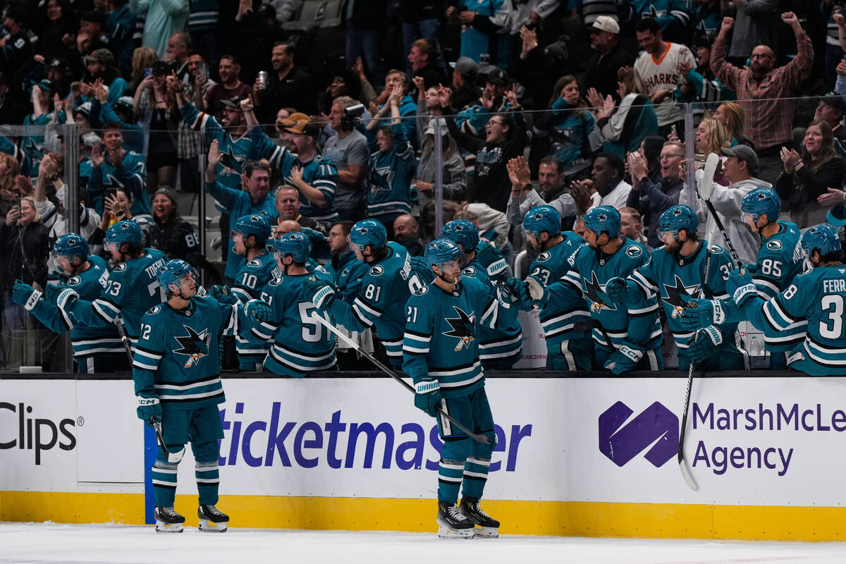 San Jose Sharks center Alexander Wennberg (21) celebrates with teammates after scoring a goal d ...