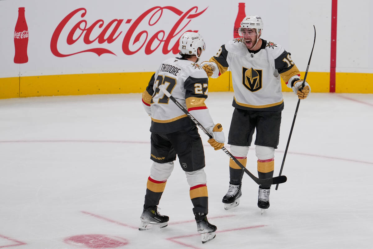 Vegas Golden Knights right wing Reilly Smith, right, celebrates with defenseman Shea Theodore a ...