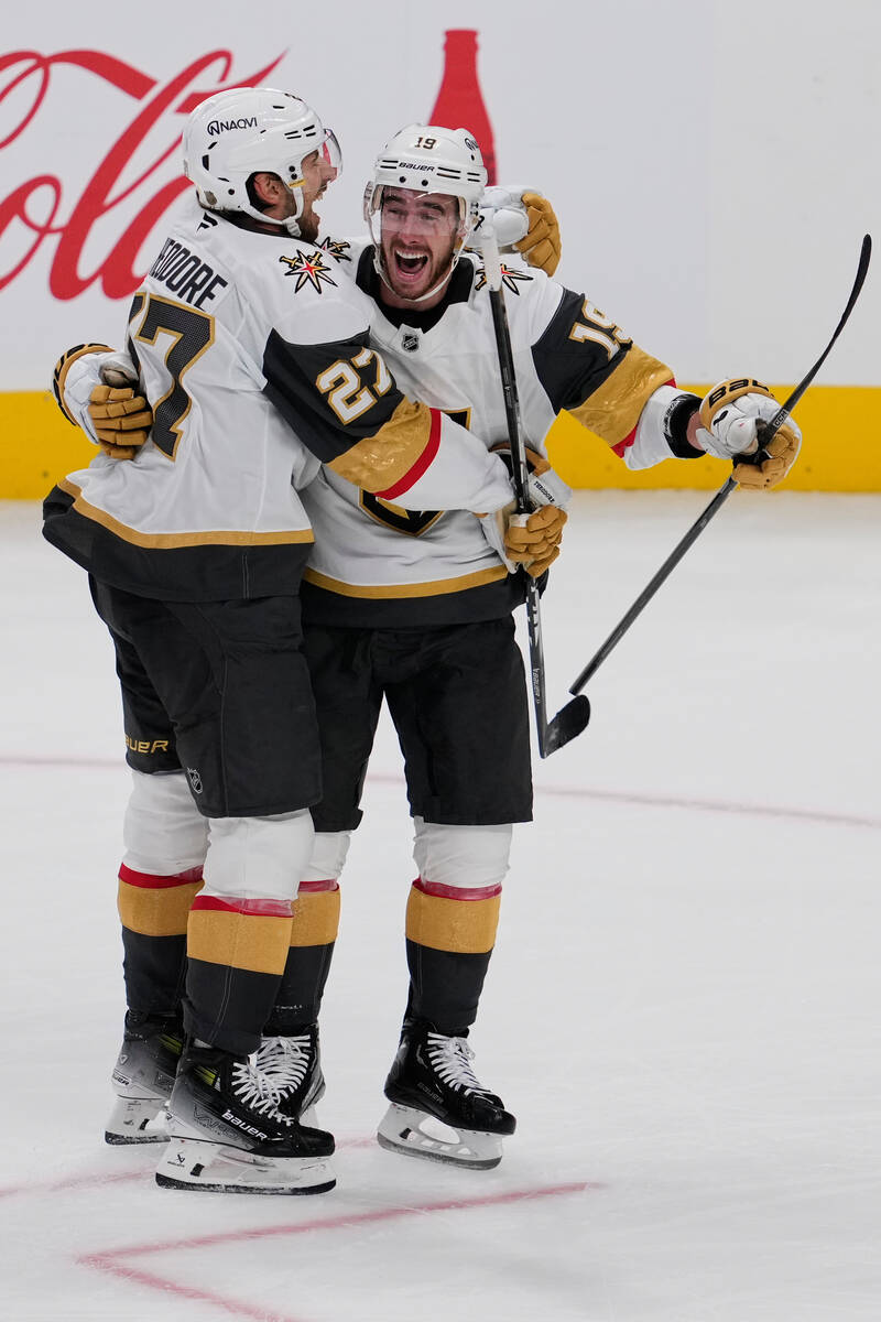 Vegas Golden Knights right wing Reilly Smith, right, celebrates with defenseman Shea Theodore a ...