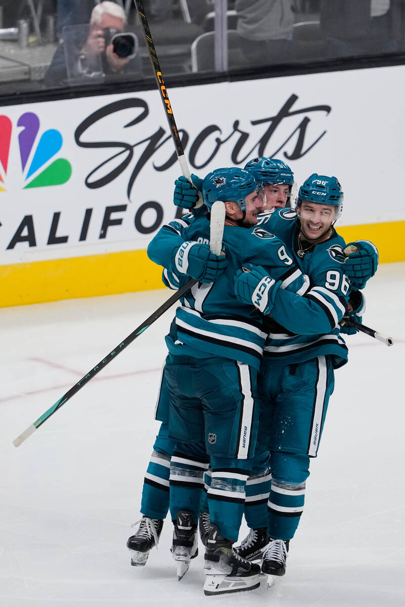 San Jose Sharks center Philipp Kurashev (96) celebrates with teammates after scoring a goal dur ...