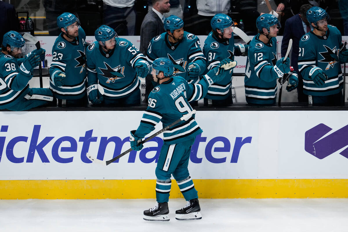 San Jose Sharks center Philipp Kurashev (96) celebrates with teammates after scoring a goal dur ...