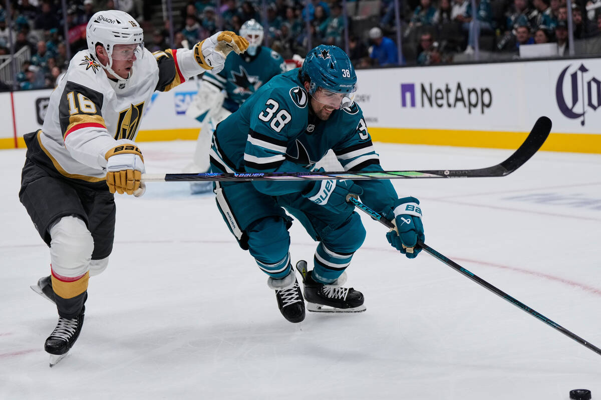 Vegas Golden Knights right wing Pavel Dorofeyev (16) and San Jose Sharks defenseman Mario Ferra ...