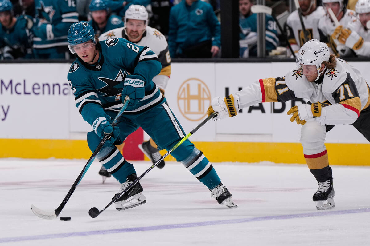 San Jose Sharks center Will Smith (2) passes the puck while defended by Vegas Golden Knights ce ...