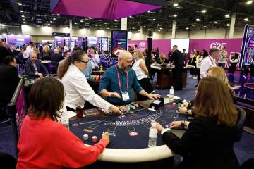 Martin Parra, middle, table games dealer at Talking Stick, competes at the G2E Dealer Champions ...