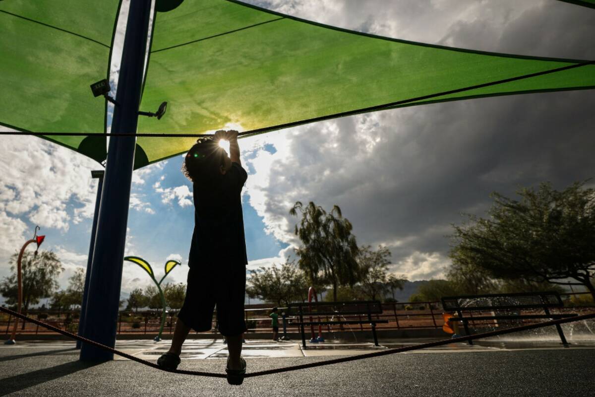 Zack Federizo, 4, watches a storm front pass over Huckleberry Park Friday, Oct. 10, 2025 in nor ...