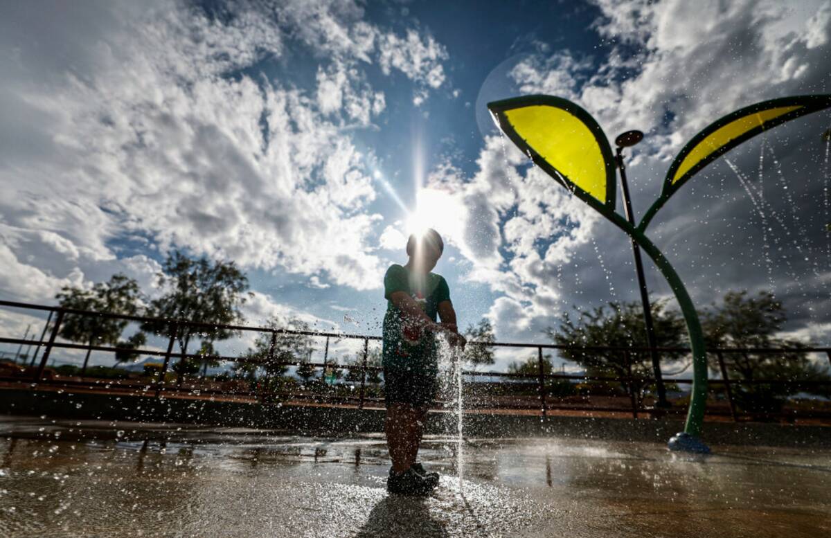 Eric Federizo, 5, plays in the water as a storm front passes over Huckleberry Park Friday, Oct. ...