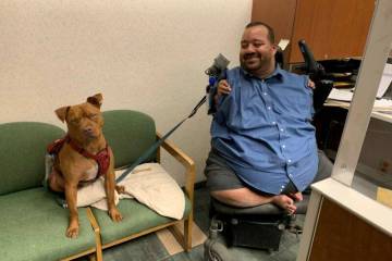 Raymond Fletcher with his dog, Hercules. (Regional Transportation Commission)