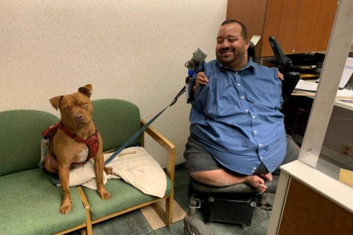 Raymond Fletcher with his dog, Hercules. (Regional Transportation Commission)