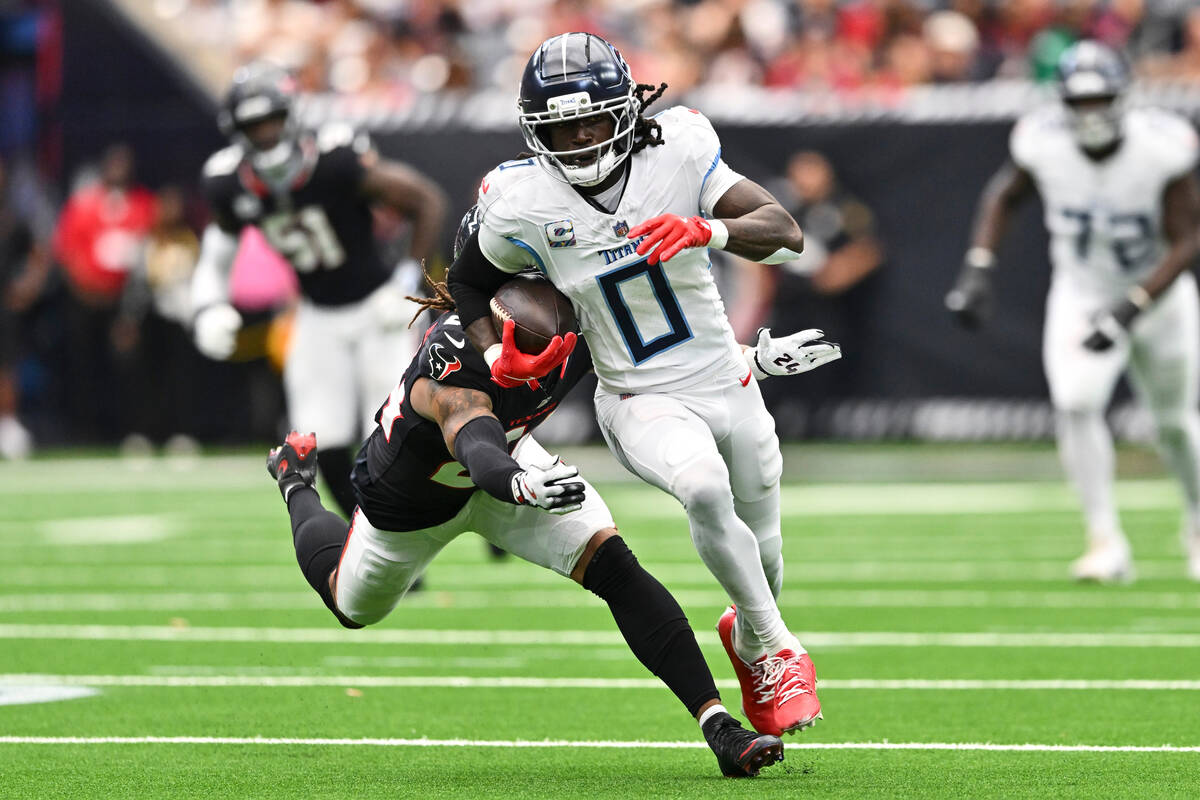 Houston Texans cornerback Derek Stingley Jr. (24) attempts to tackle Tennessee Titans wide rece ...