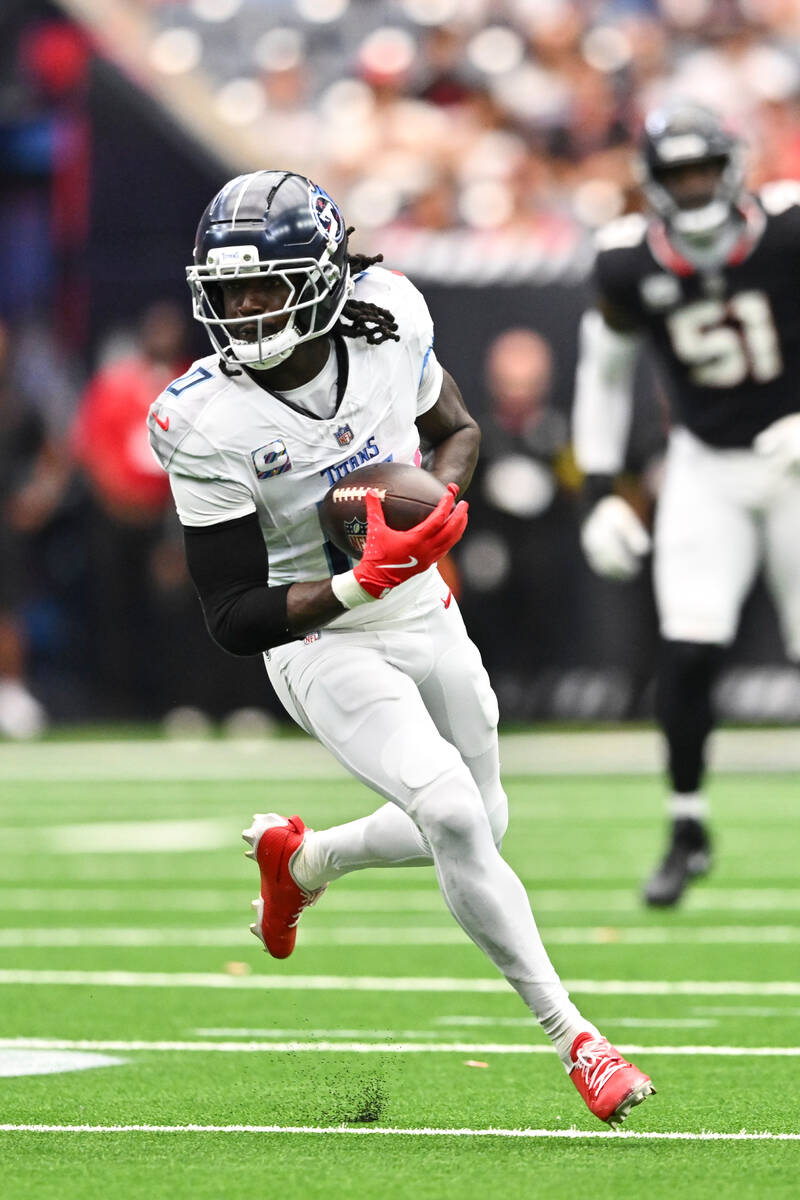Tennessee Titans wide receiver Calvin Ridley (0) runs the ball against the Houston Texans durin ...