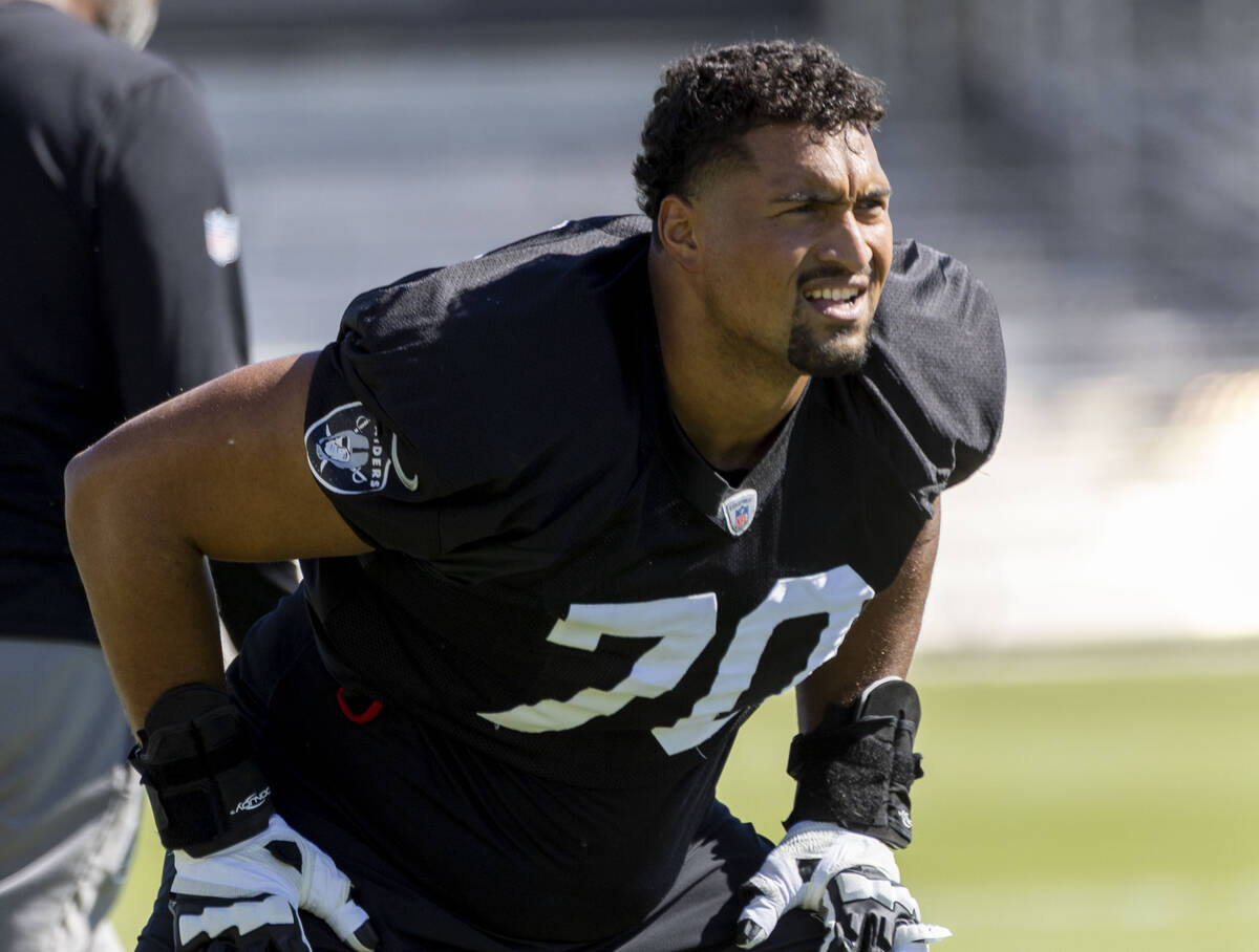Raiders offensive tackle Stone Forsythe (70) stretches during the team’s practice at the ...